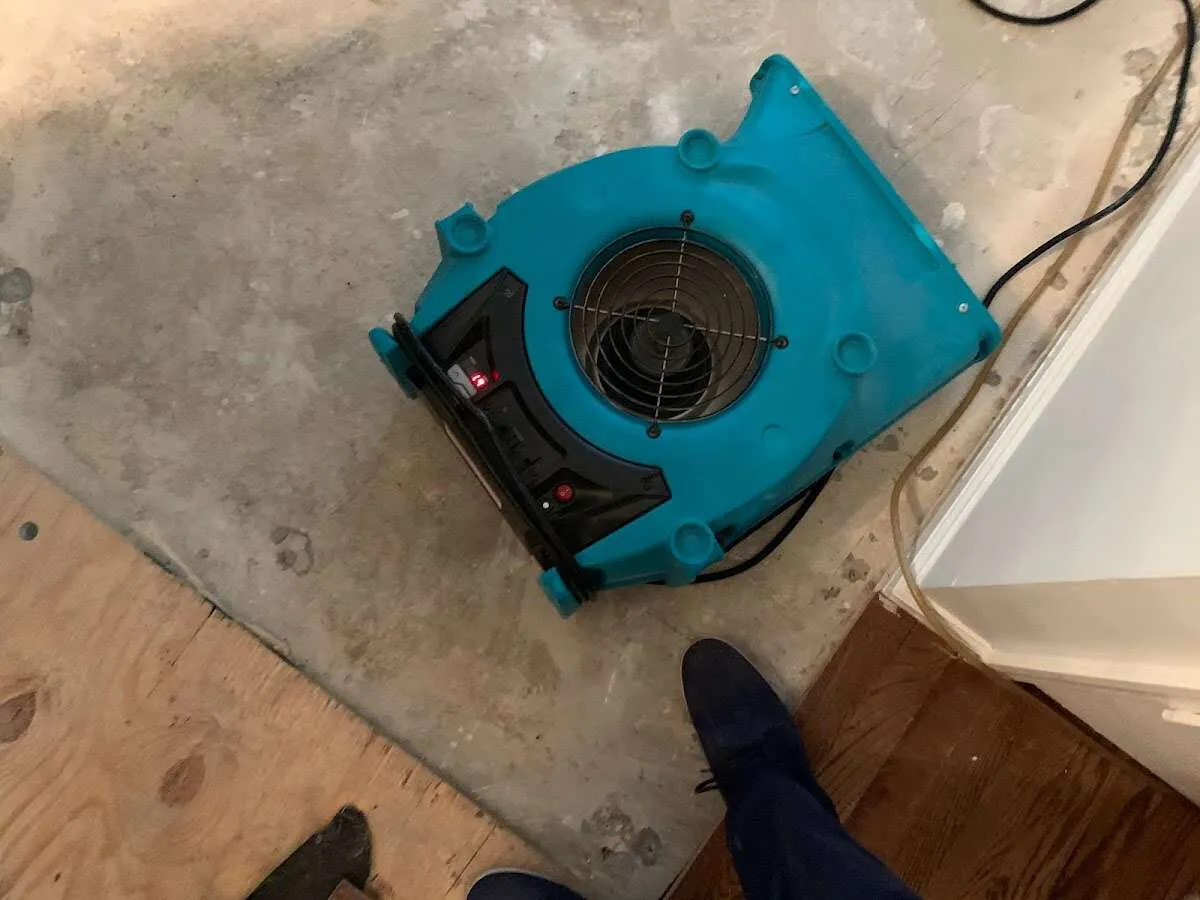 Air mover drying subfloor during Leak Detection & Repair in New Hartford